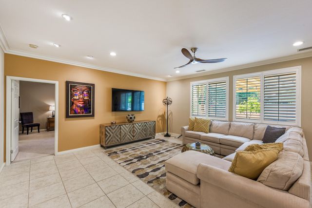 a living room with furniture and window