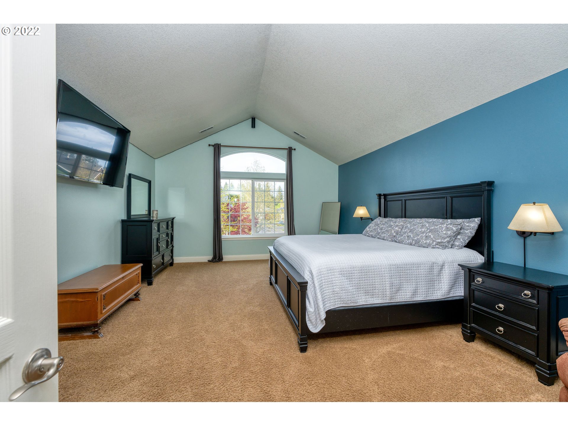 2785 North Fremont Street Cornelius, OR 97113 - Photo 13 of 32 a bedroom with a bed and a lamp on dresser