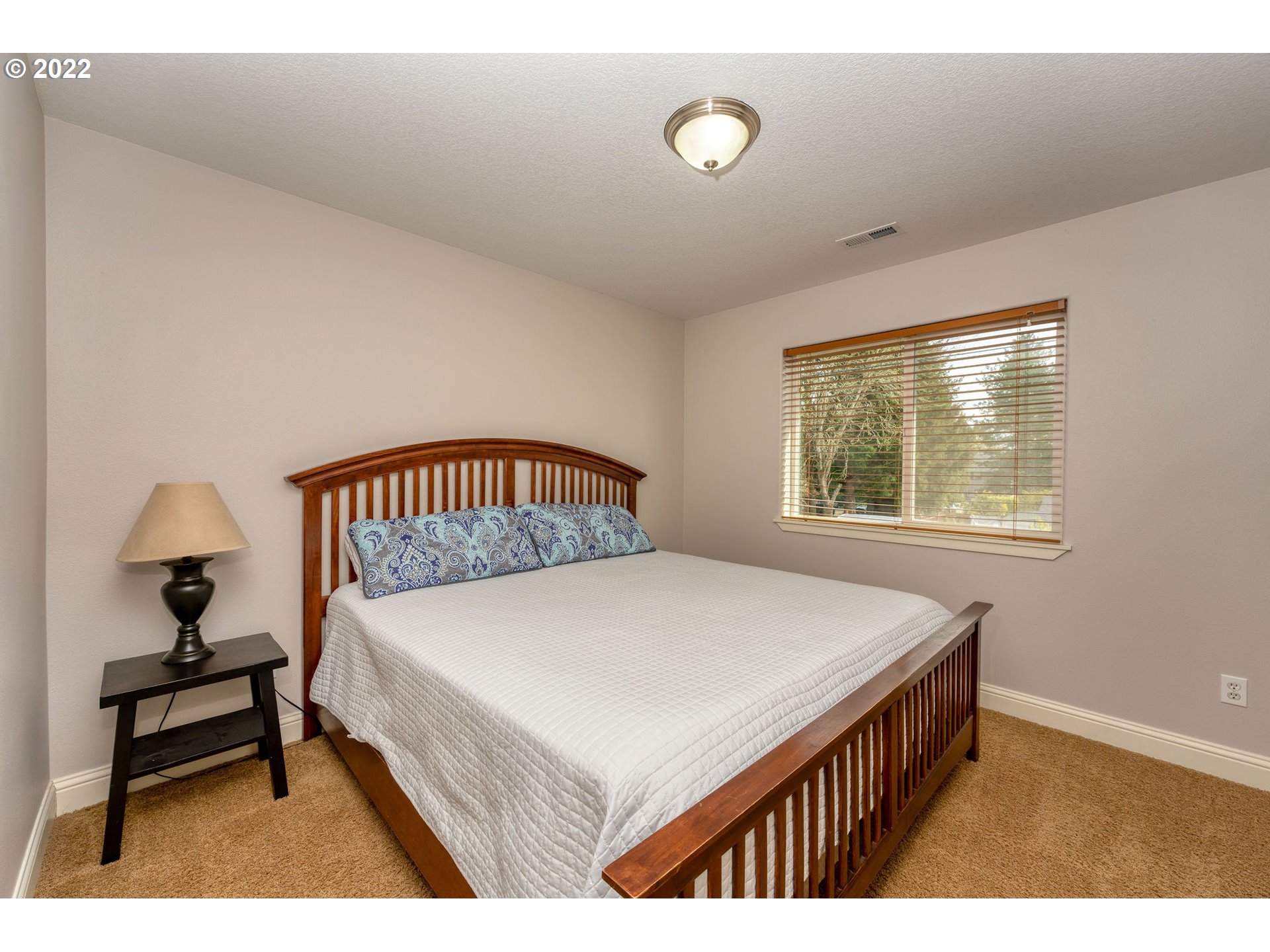 2785 North Fremont Street Cornelius, OR 97113 - Photo 18 of 32 a bedroom with a bed and a window