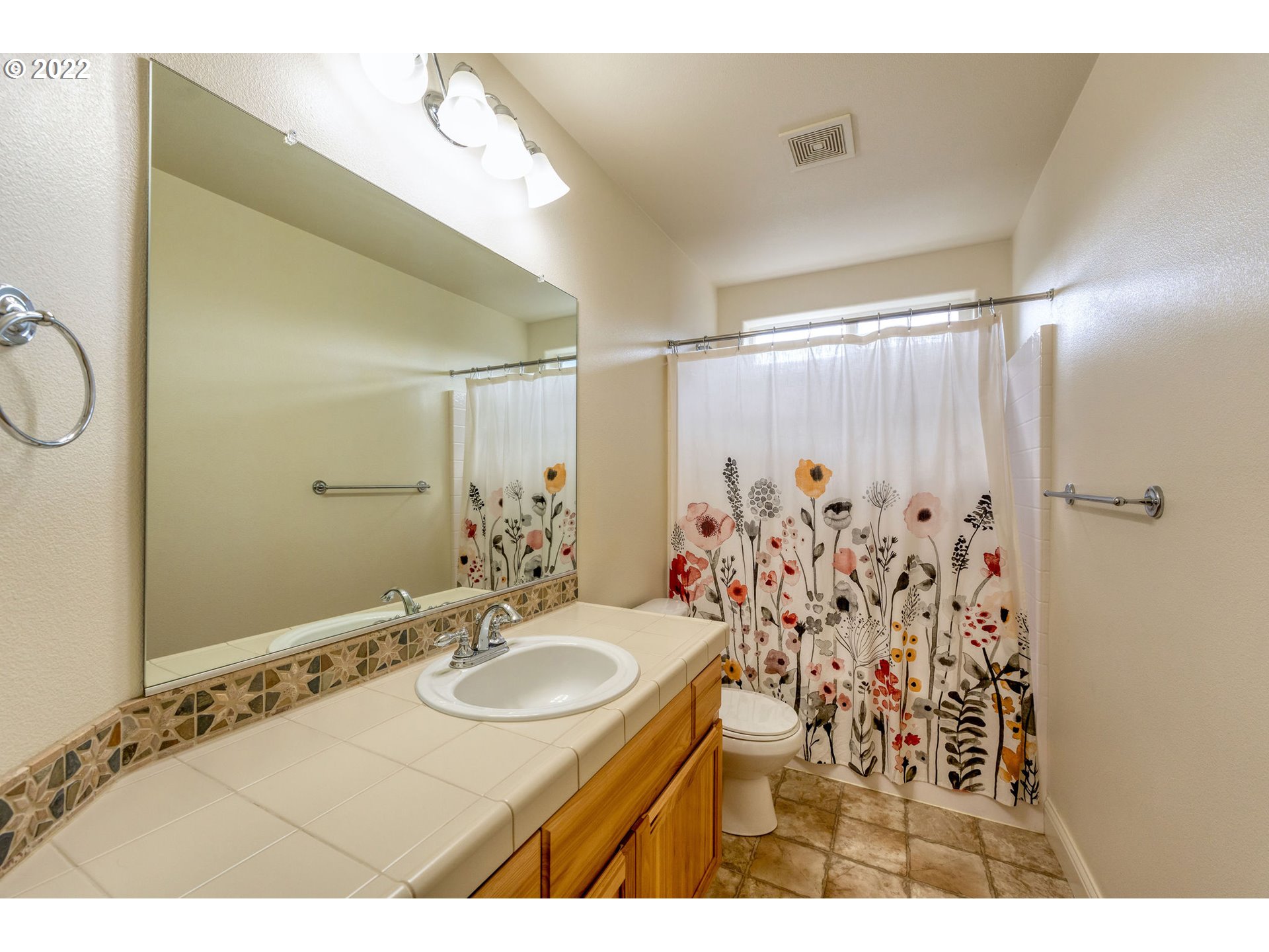 2785 North Fremont Street Cornelius, OR 97113 - Photo 19 of 32 a bathroom with a granite countertop sink and a mirror