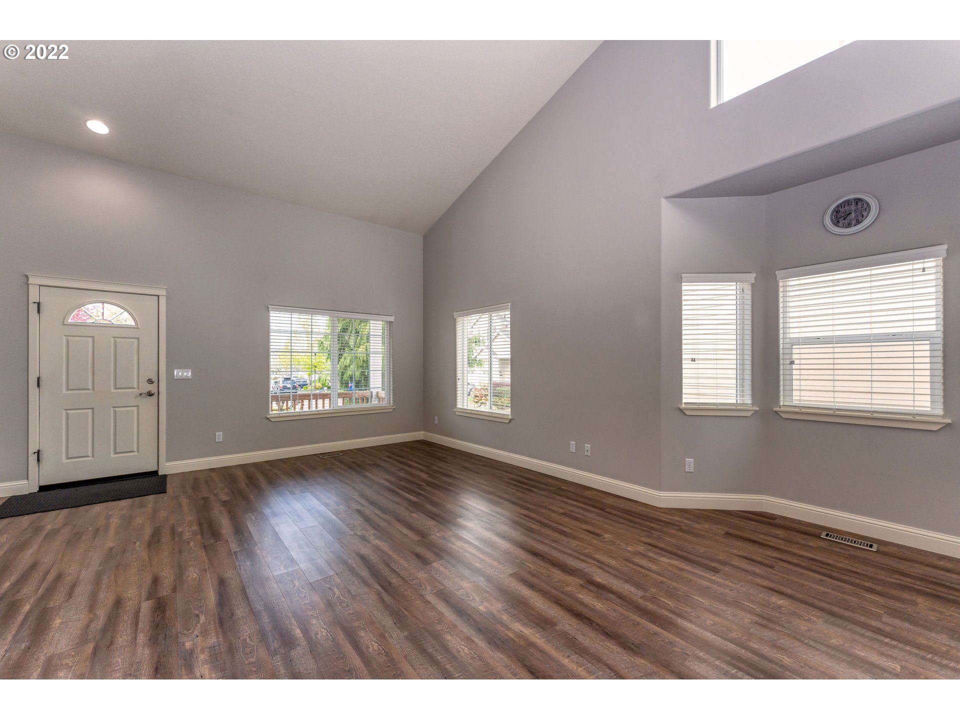2785 North Fremont Street Cornelius, OR 97113 - Photo 7 of 32 a view of an empty room with wooden floor and a window