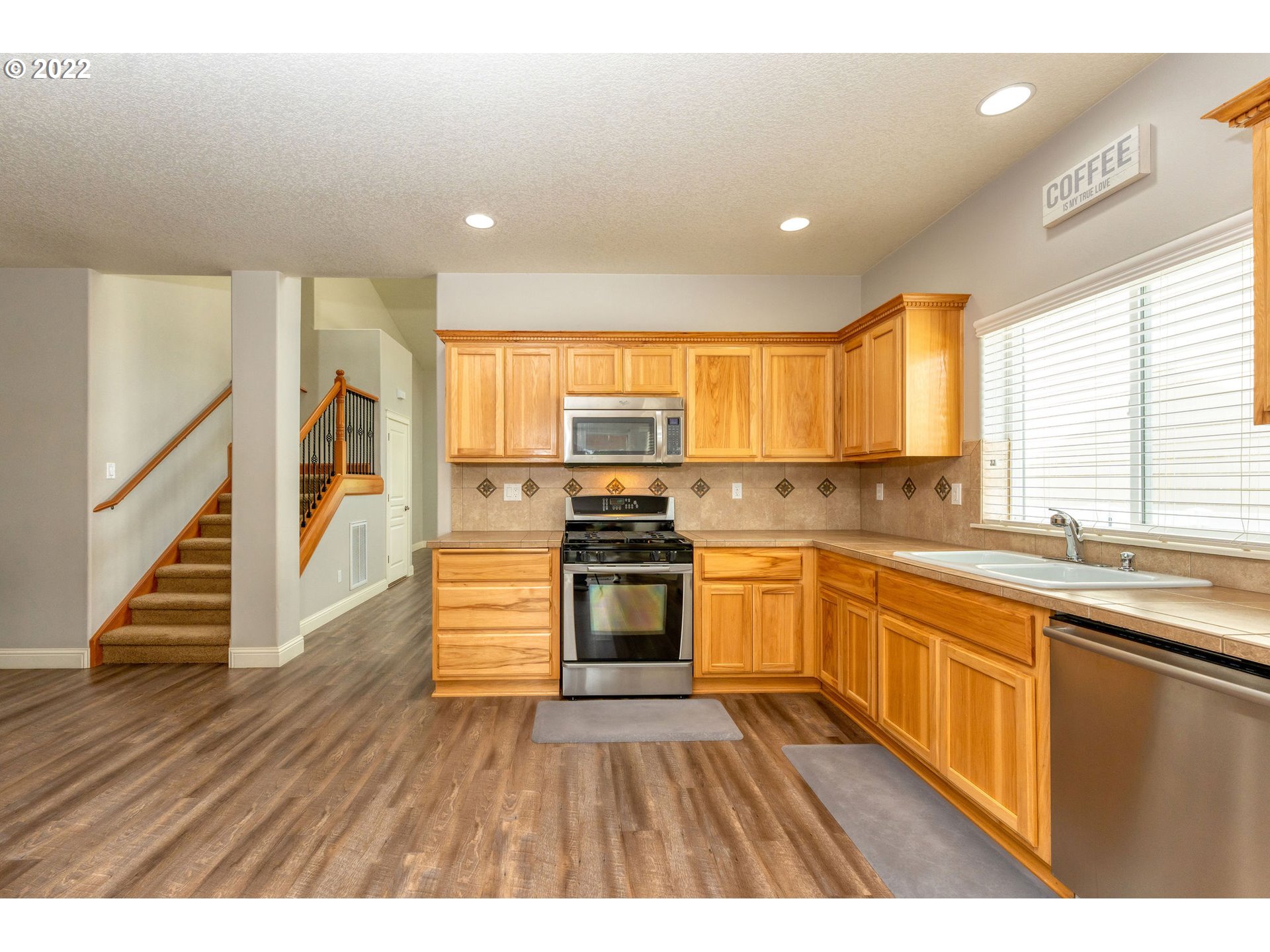2785 North Fremont Street Cornelius, OR 97113 - Photo 9 of 32 a kitchen with stainless steel appliances granite countertop a stove a sink and a refrigerator