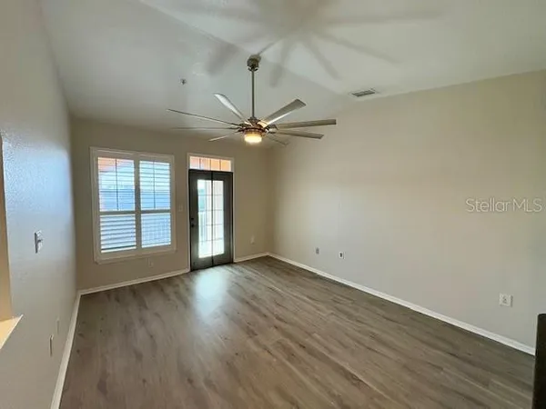 a bathroom with a toilet and a mirror