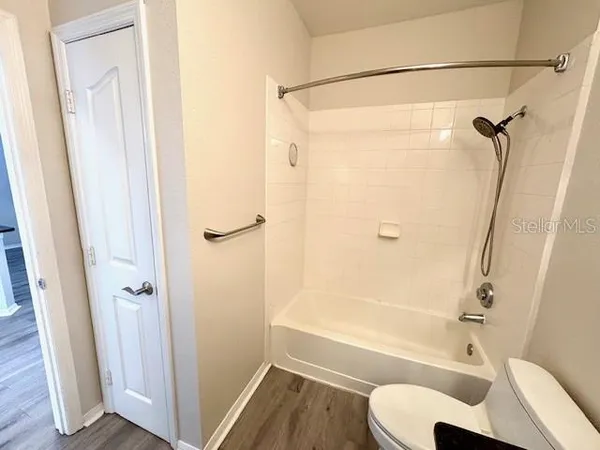 a view of a kitchen with a sink and cabinets