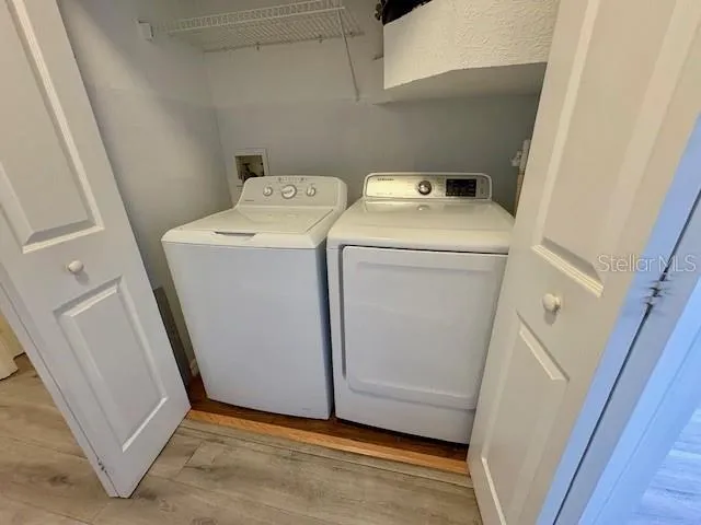 a view of a balcony with wooden floor