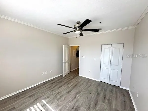 a view of balcony with wooden floor and fence