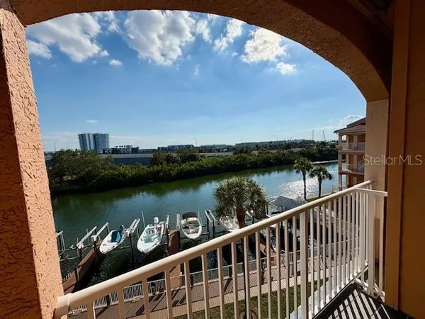a palm tree sitting in front of a building