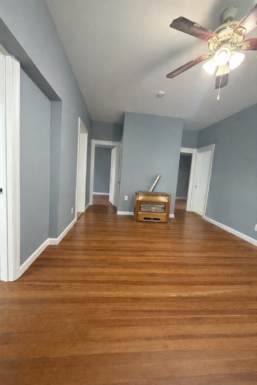 50 Haffards Street, Unit 1 Fall River, MA 02723 - Photo 2 of 7 a view of a room with wooden floor and chandelier fan