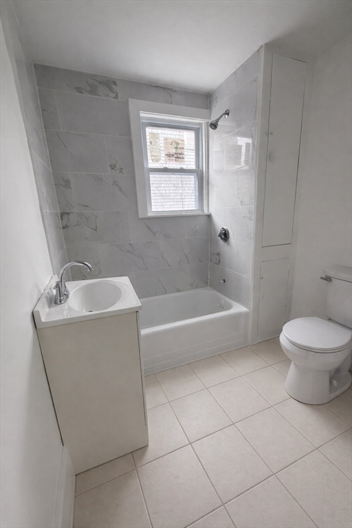 50 Haffards Street, Unit 1 Fall River, MA 02723 - Photo 5 of 7 a spacious bathroom with a toilet a sink and bathtub