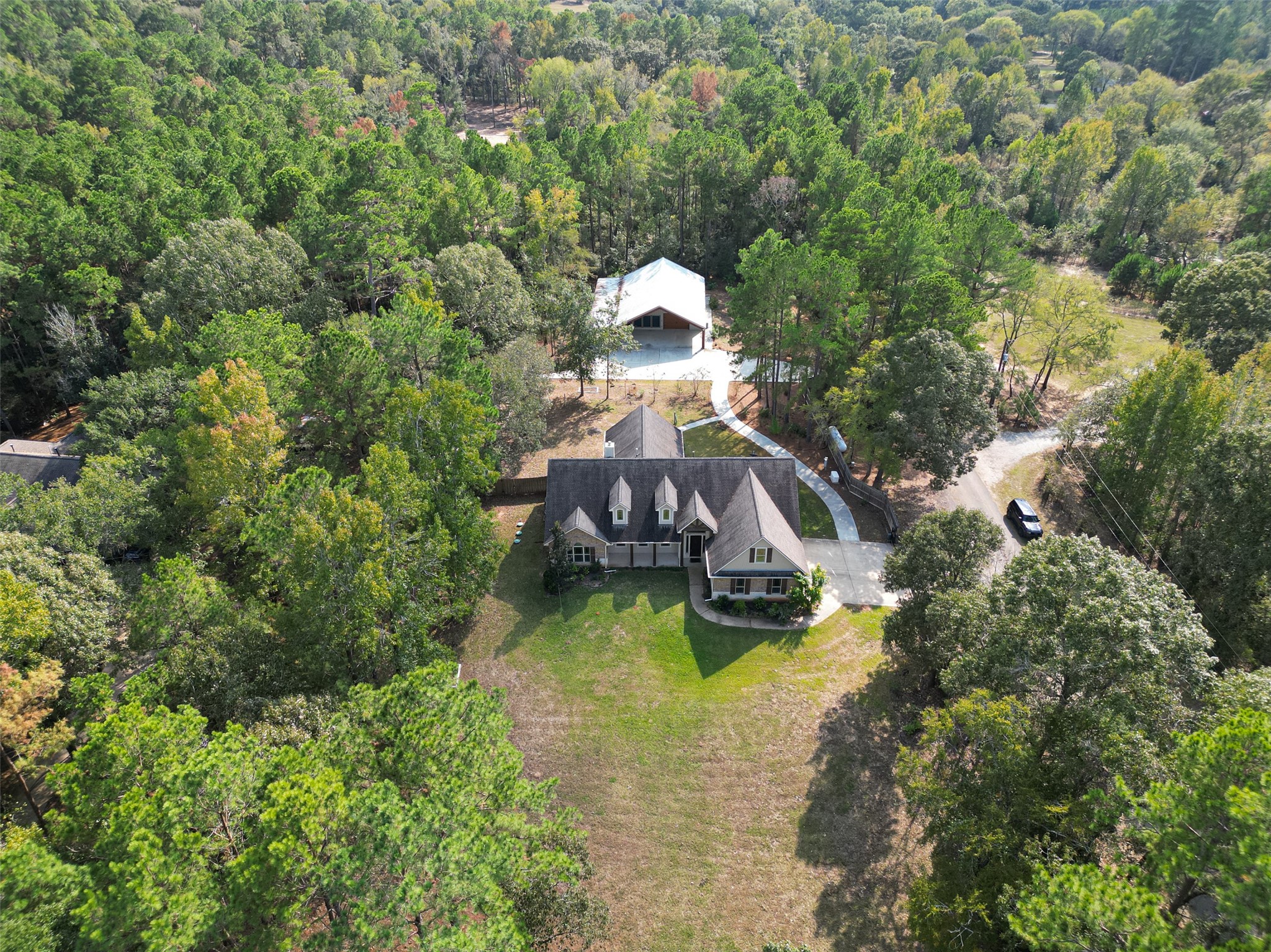 a aerial view of a house with swimming pool and garden
