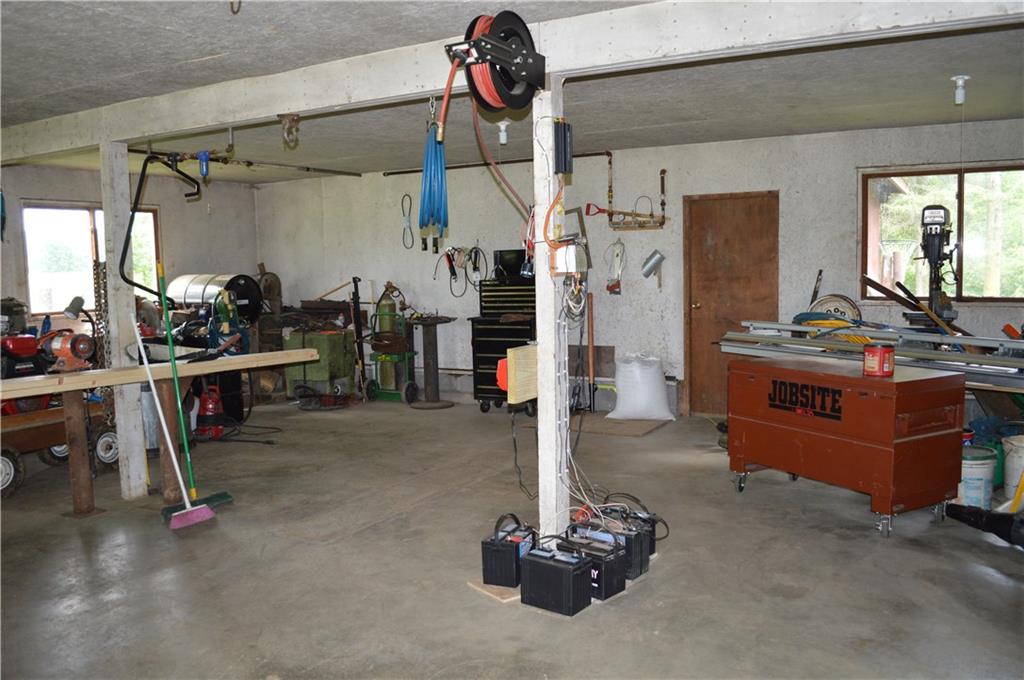 30172 State Rte 27 Guys Mills, PA 16327 - Photo 3 of 25 Workshop interior has stairs to 2nd floor storage.
