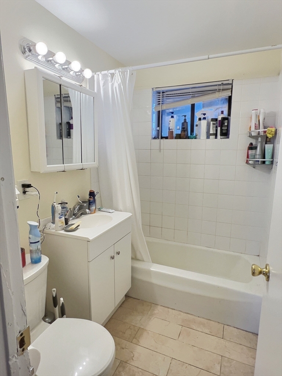 1039 Commonwealth Avenue, Unit 18 Boston, MA 02215 - Photo 6 of 6 a bathroom with a sink a toilet and shower