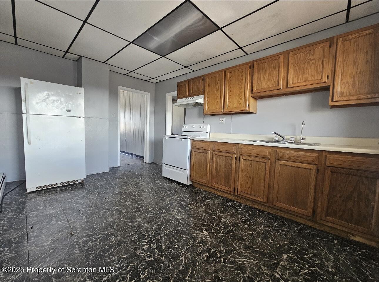 202 Moosic Road Old Forge, PA 18518 - Photo 5 of 8 a kitchen with a sink stainless steel appliances and cabinets