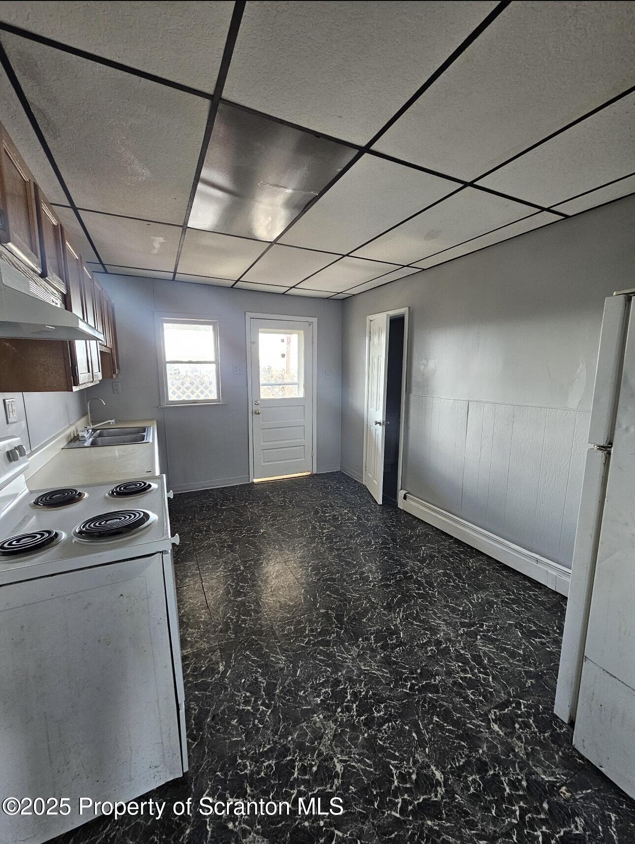 202 Moosic Road Old Forge, PA 18518 - Photo 6 of 8 a view of empty room with window and fireplace