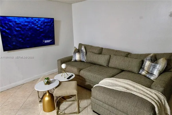 a living room with furniture and couch