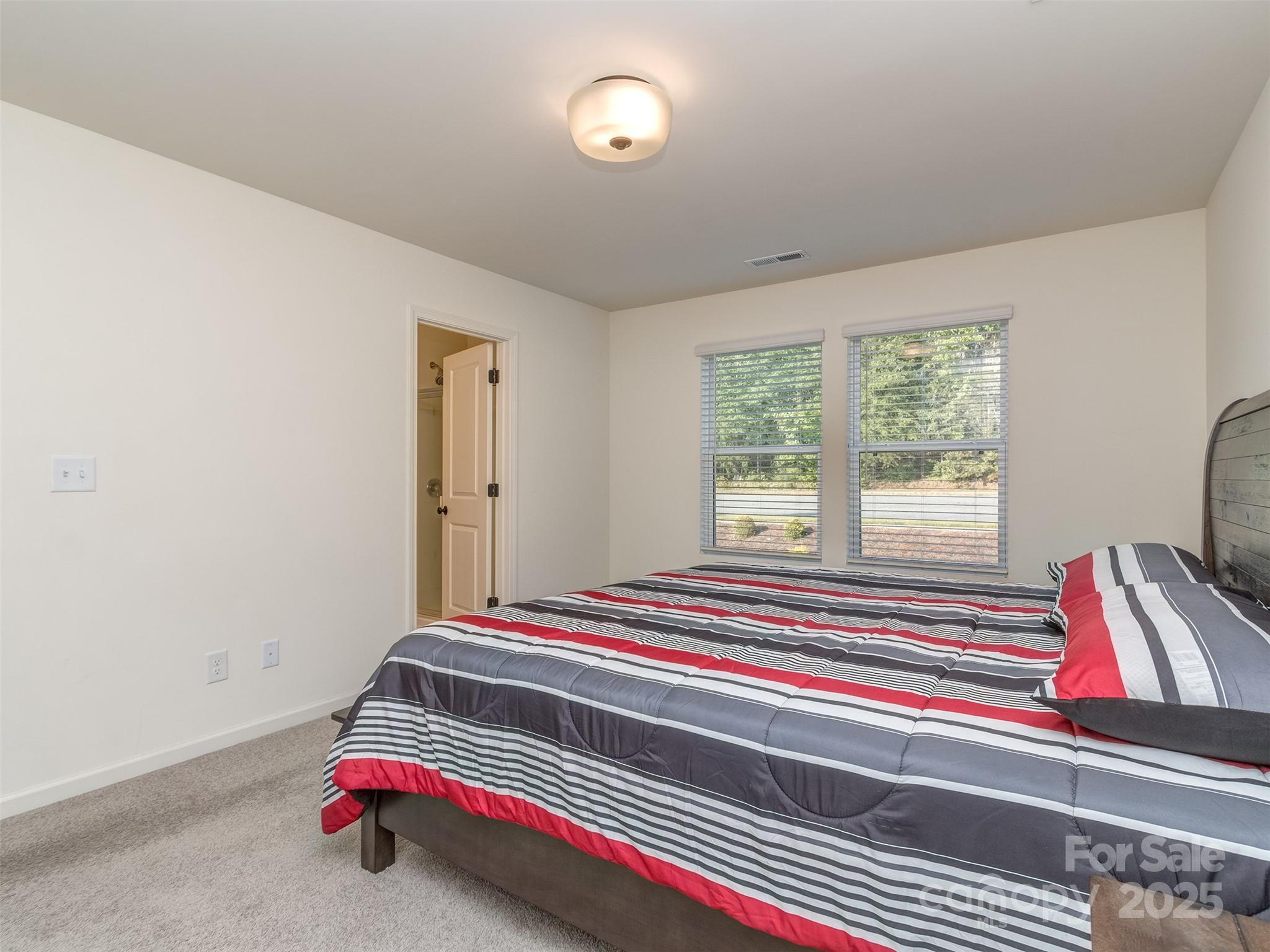 2024 Crooked Oak Lane York, SC 29745 - Photo 14 of 25 a bedroom with bed and a window