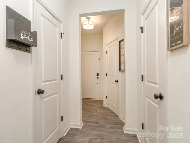 a view of a hallway with walk in closet