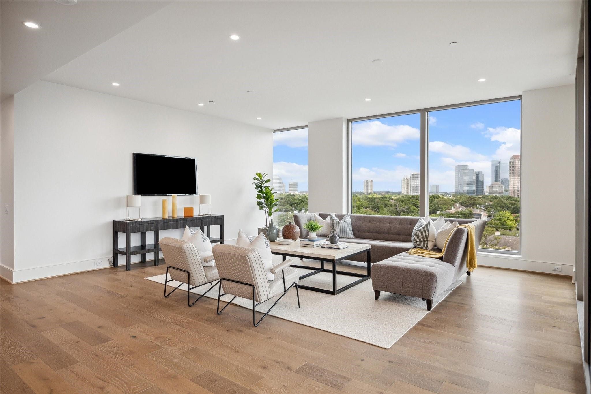 5656 San Felipe Street, Unit 601 Houston, TX 77056 - Photo 20 of 45 Floor-to-ceiling windows showcase panoramic views of the city. Photos are of a similar unit with the same floor plan