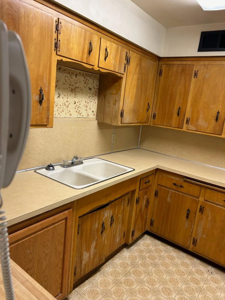 229 E Street Los Banos, CA 93635 - Photo 7 of 9 a bathroom with a sink and a mirror
