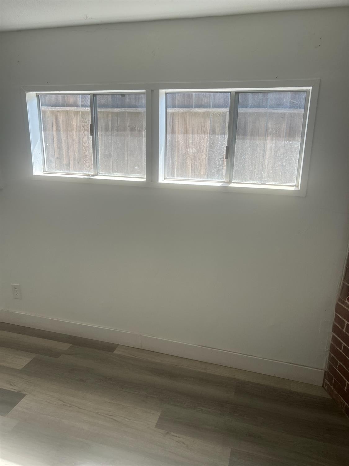 229 E Street Los Banos, CA 93635 - Photo 8 of 9 an empty room with a window
