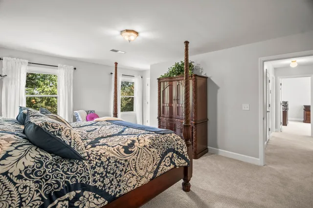 a kitchen with stainless steel appliances kitchen island a refrigerator sink and cabinets