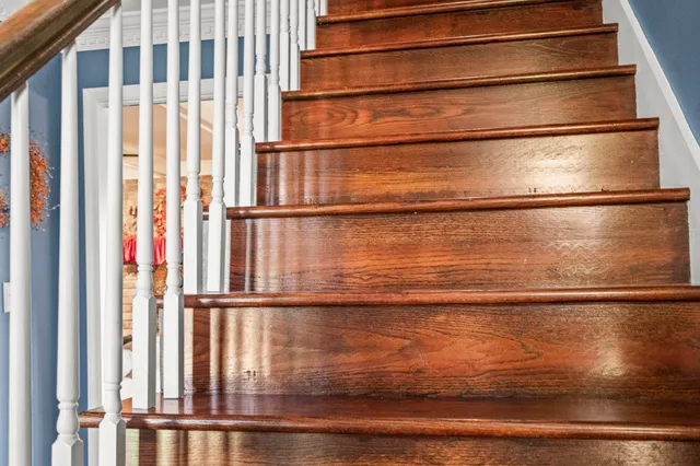 an aerial view of a house with a yard swimming pool and outdoor seating