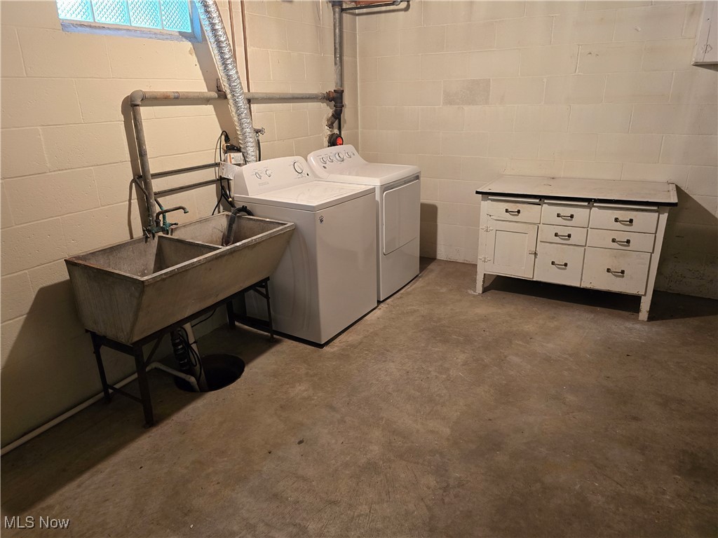 67 Moore Road Akron, OH 44319 - Photo 13 of 15 Clothes washing area featuring cabinets and washer and dryer