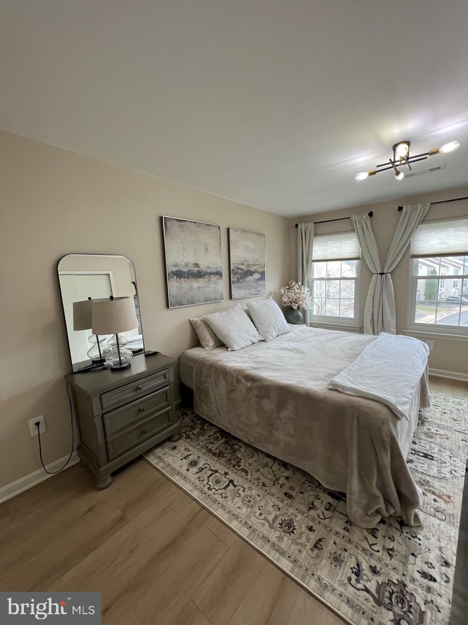 20202 Foothill Terrace Ashburn, VA 20147 - Photo 14 of 26 a bedroom with a bed window and couch