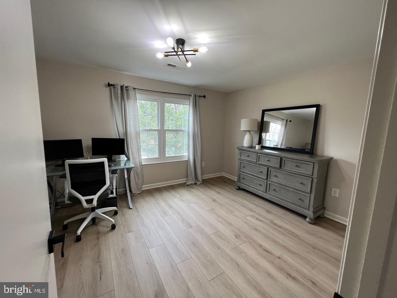 20202 Foothill Terrace Ashburn, VA 20147 - Photo 19 of 26 a view of a workspace with furniture and a window