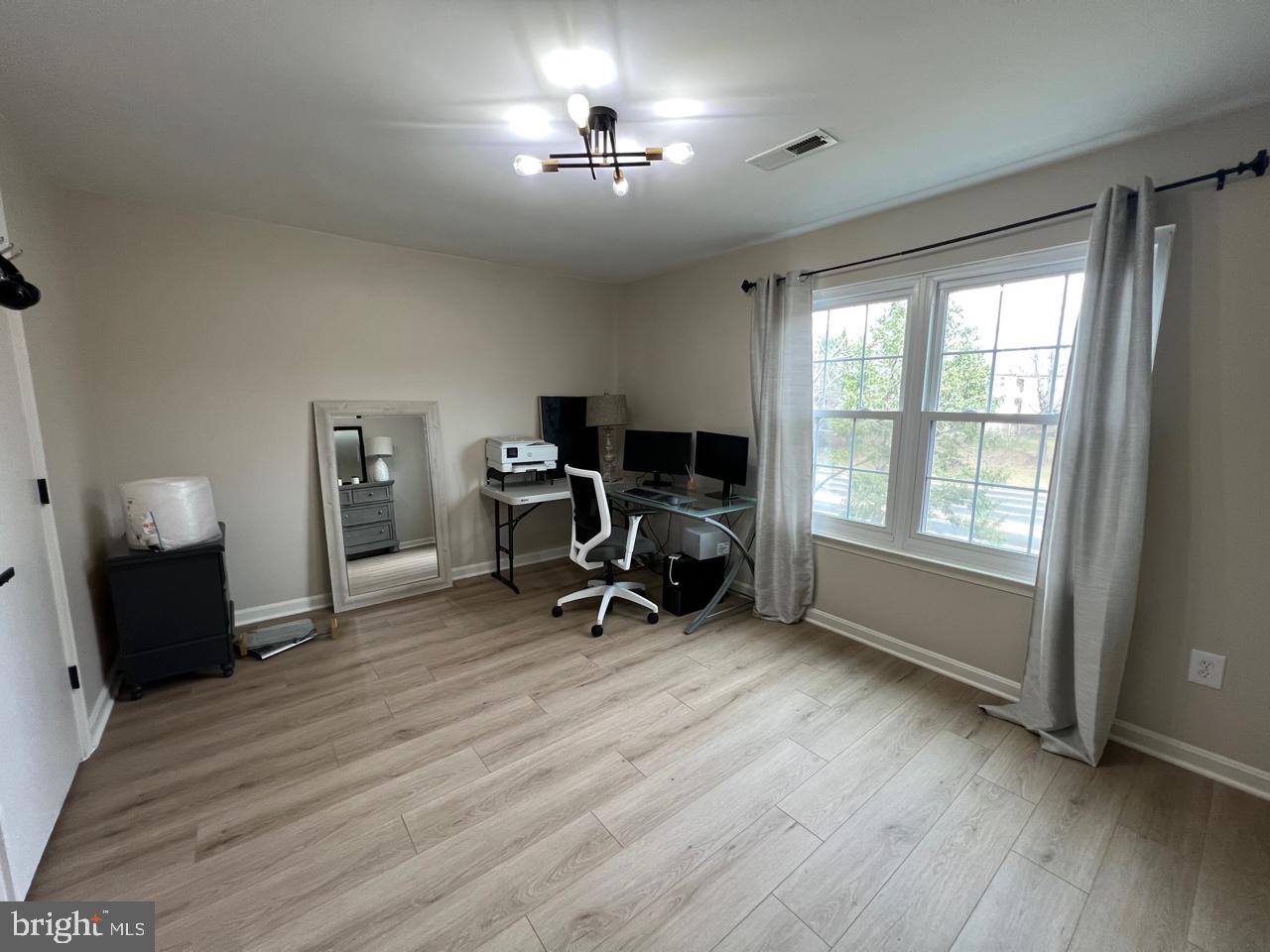 20202 Foothill Terrace Ashburn, VA 20147 - Photo 20 of 26 a view of a workspace with furniture and a window