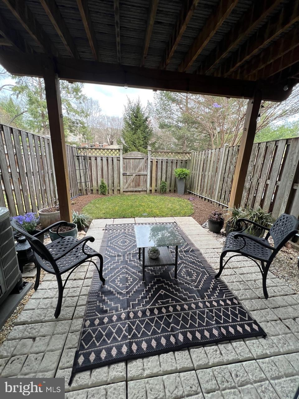 20202 Foothill Terrace Ashburn, VA 20147 - Photo 26 of 26 a view of chairs and table in patio with wooden floor