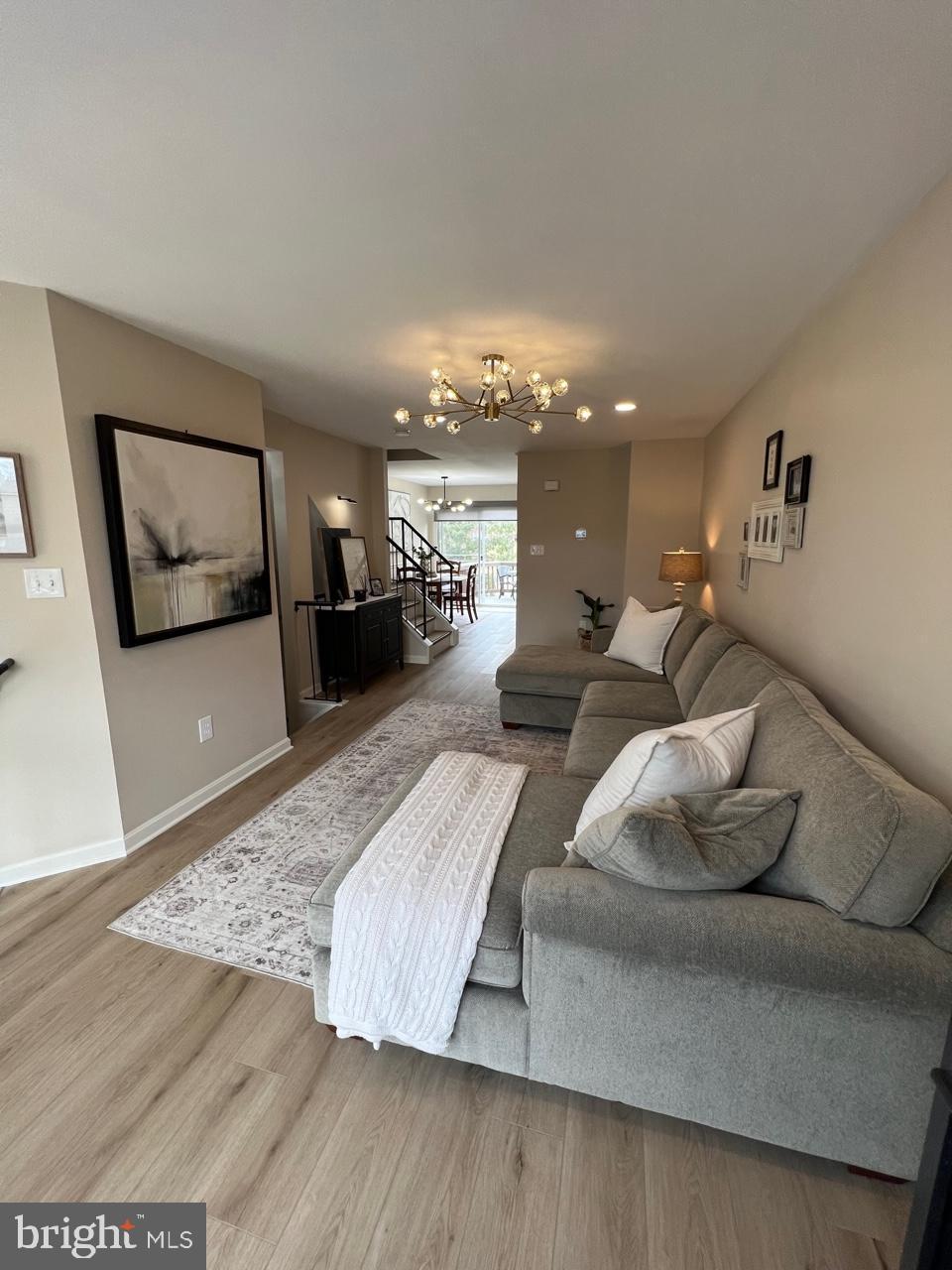 20202 Foothill Terrace Ashburn, VA 20147 - Photo 4 of 26 a living room with furniture and a flat screen tv