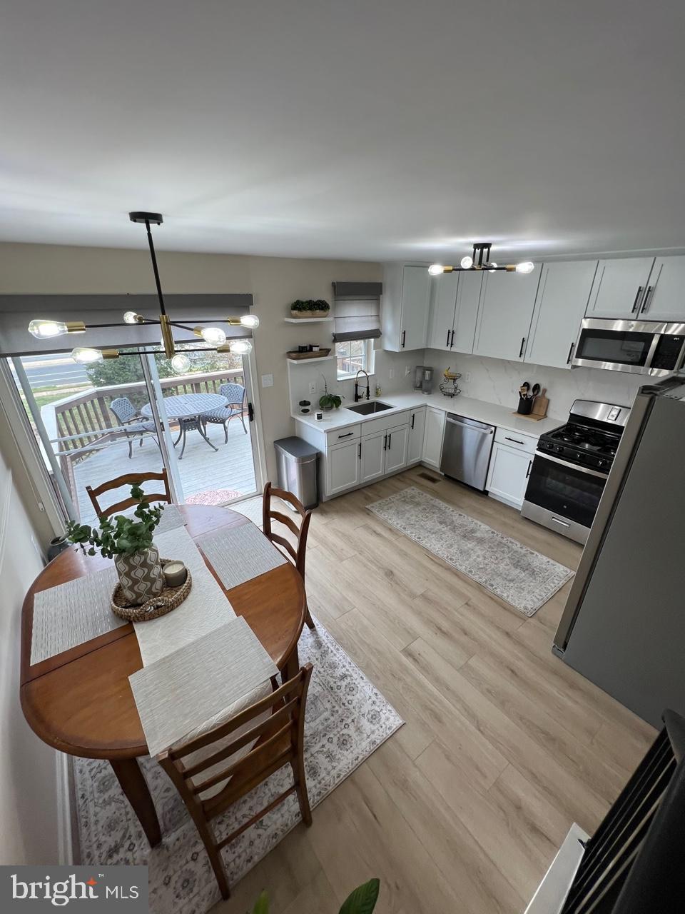 20202 Foothill Terrace Ashburn, VA 20147 - Photo 7 of 26 a room with furniture and view kitchen
