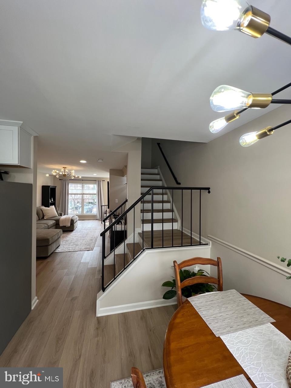 20202 Foothill Terrace Ashburn, VA 20147 - Photo 10 of 26 a living room with furniture and a wooden floor