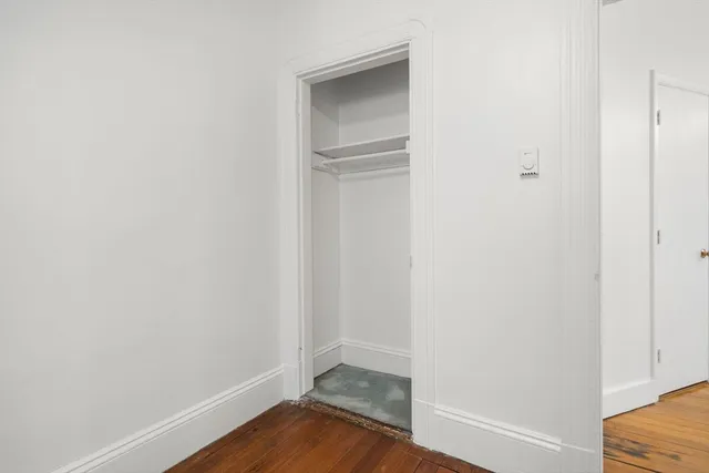 a view of a small space with wooden floor