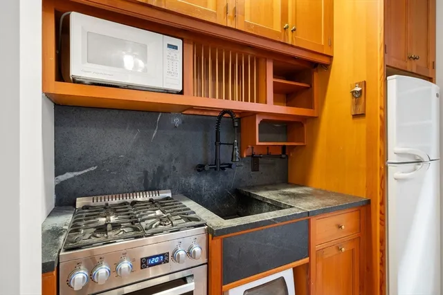 a kitchen with a stove and a microwave