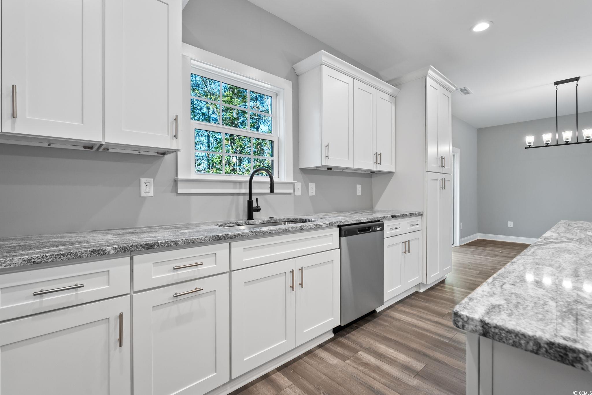 2122 Highway 9 Business Loris, SC 29569 - Photo 11 of 32 Kitchen with white cabinetry, dark wood-style flooring, light stone countertops, decorative light fixtures, and recessed lighting