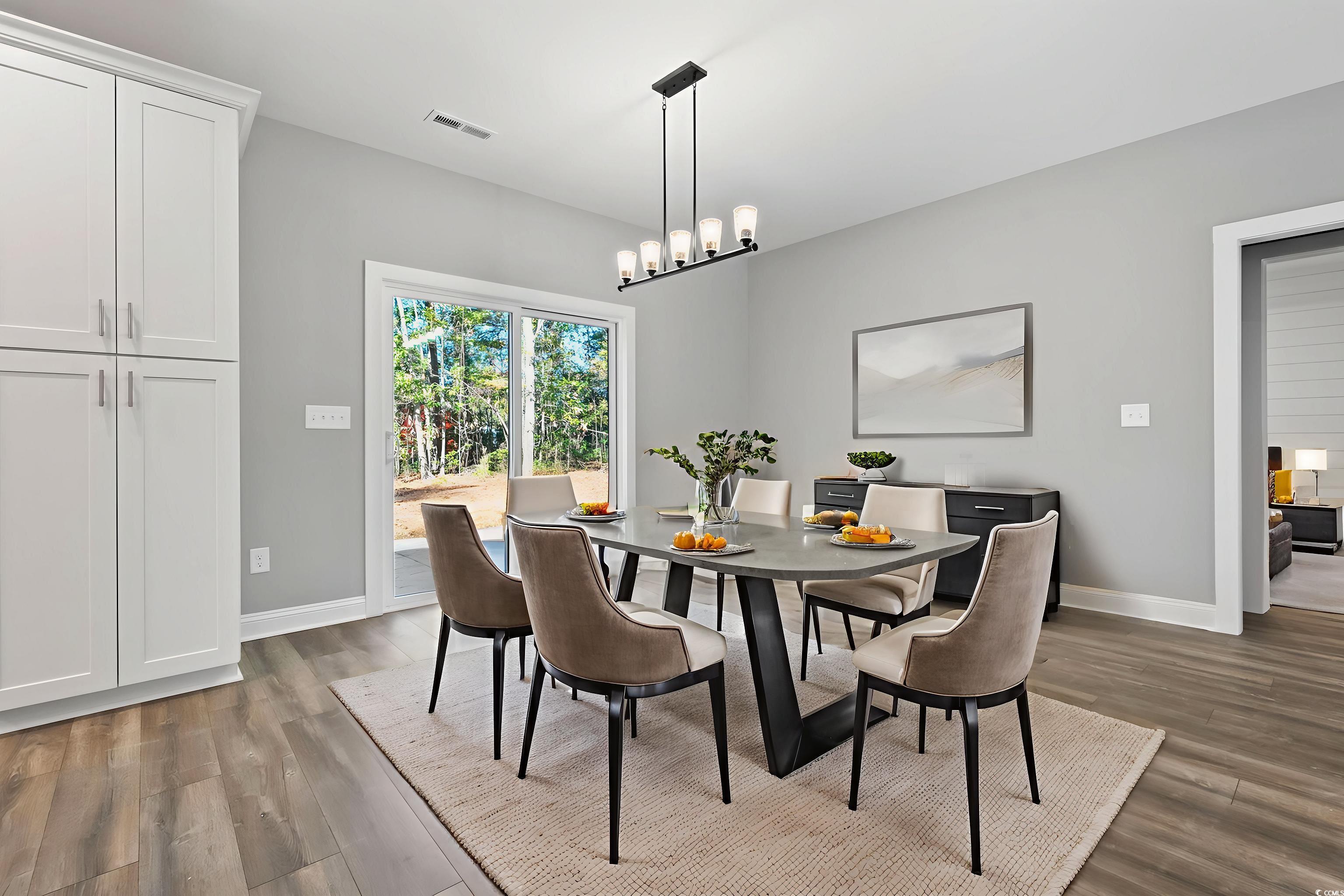 2122 Highway 9 Business Loris, SC 29569 - Photo 16 of 32 Dining space with dark wood finished floors and baseboards