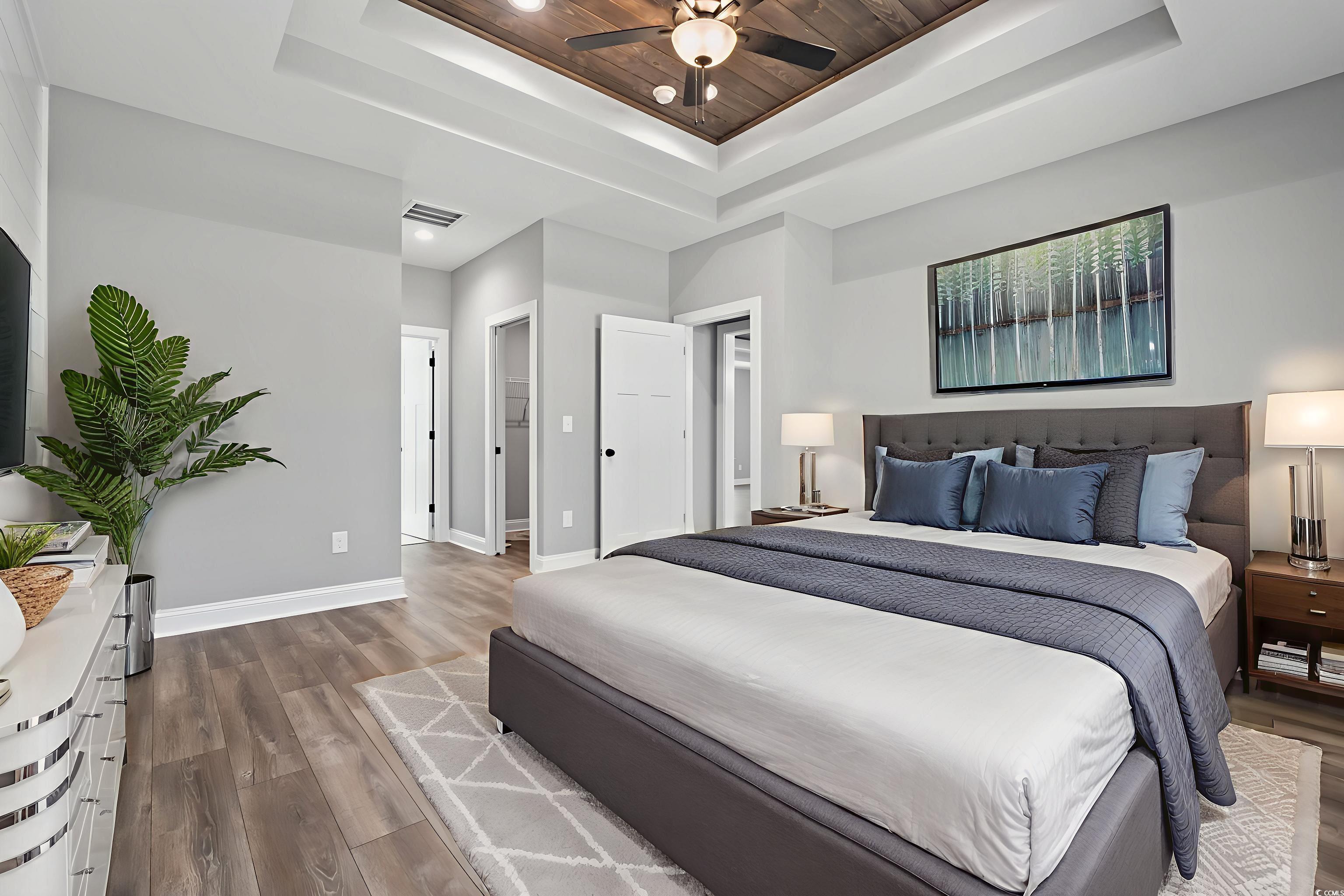 2122 Highway 9 Business Loris, SC 29569 - Photo 19 of 32 Bedroom with a raised ceiling, wood finished floors, a ceiling fan, and wood ceiling
