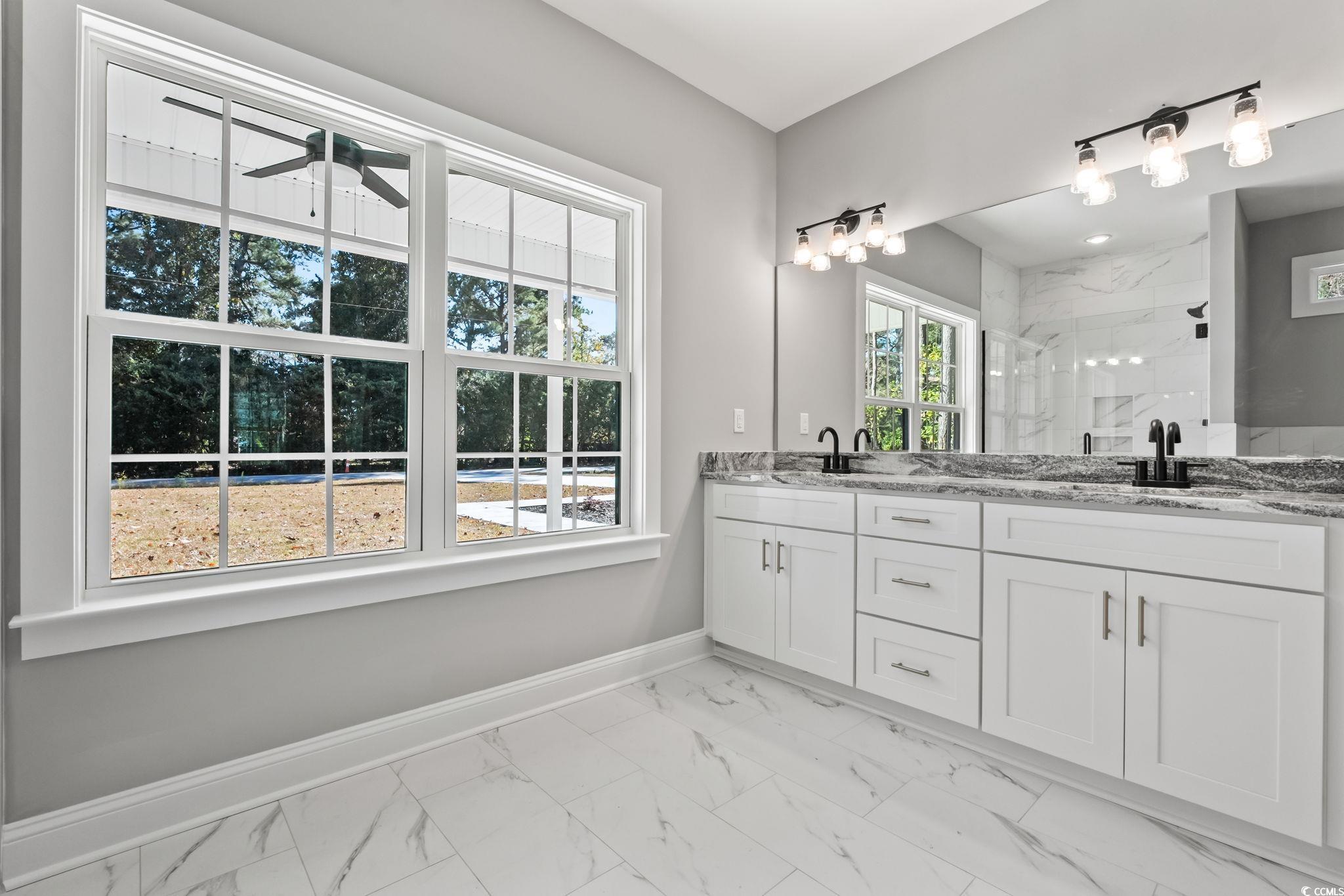 2122 Highway 9 Business Loris, SC 29569 - Photo 24 of 32 Bathroom with a marble finish shower, double vanity, light marble finish flooring, and ceiling fan