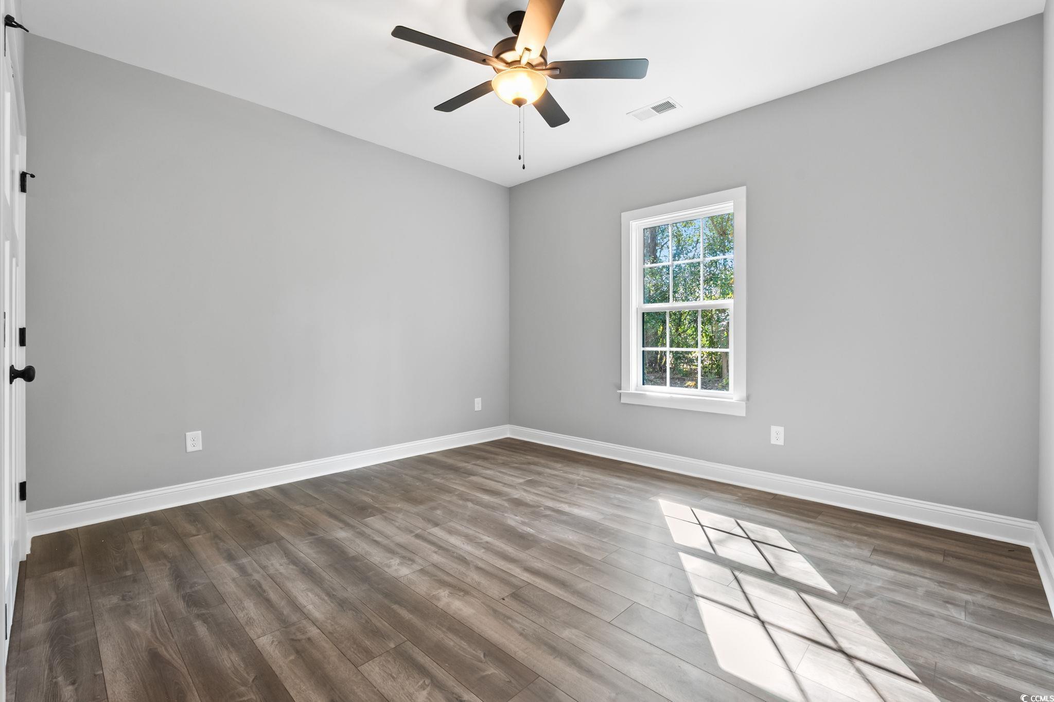 2122 Highway 9 Business Loris, SC 29569 - Photo 26 of 32 Empty room with light wood-style flooring and ceiling fan