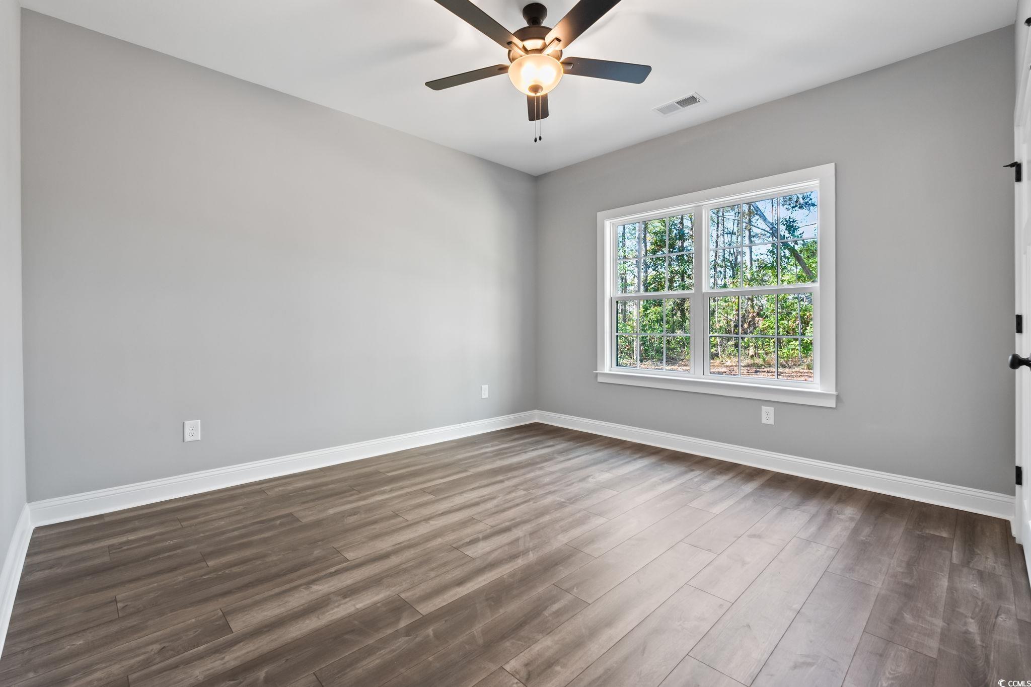 2122 Highway 9 Business Loris, SC 29569 - Photo 28 of 32 Spare room featuring wood finished floors and a ceiling fan