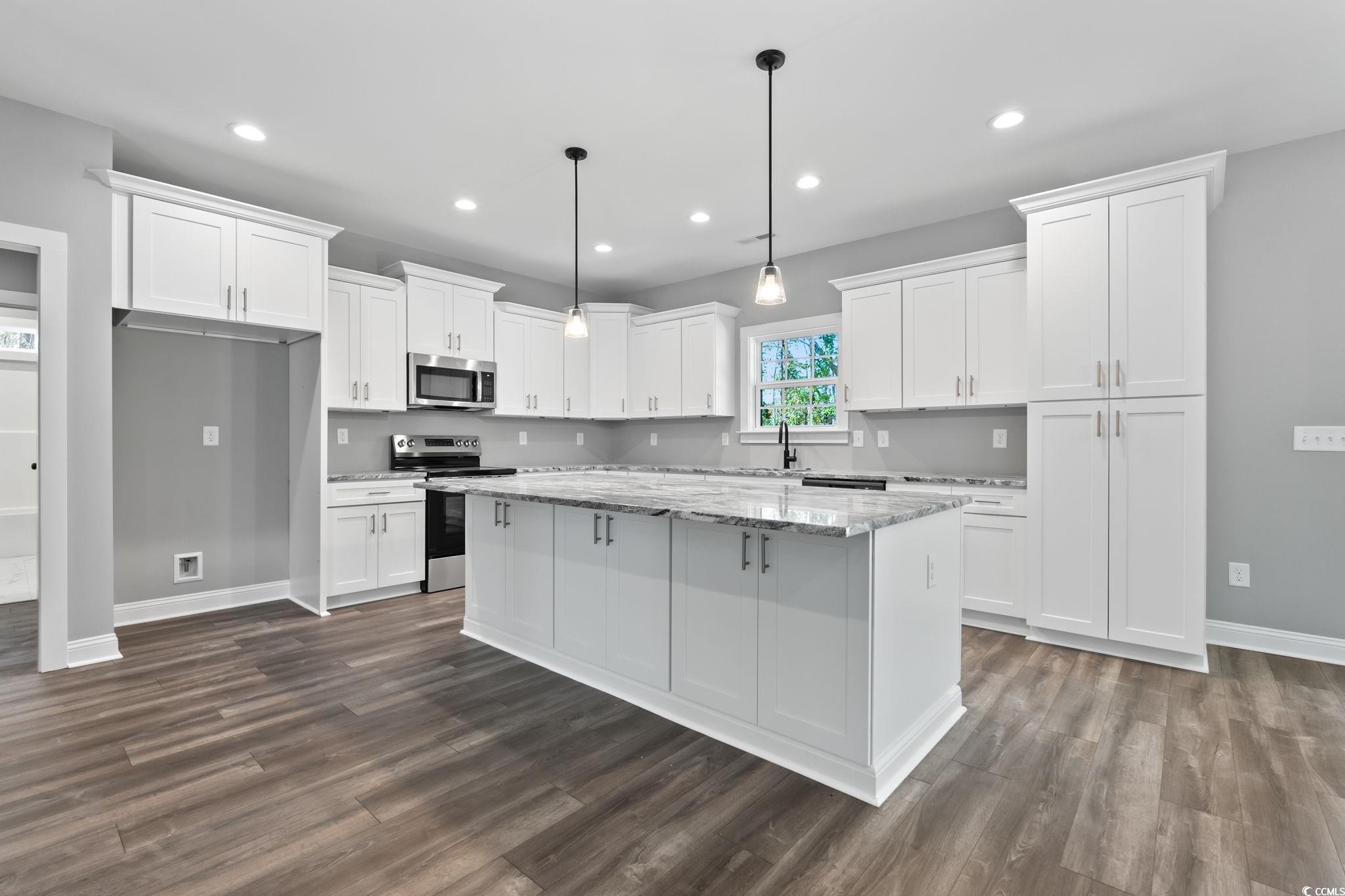 2122 Highway 9 Business Loris, SC 29569 - Photo 9 of 32 Kitchen with appliances with stainless steel finishes, light stone countertops, decorative light fixtures, white cabinets, and recessed lighting