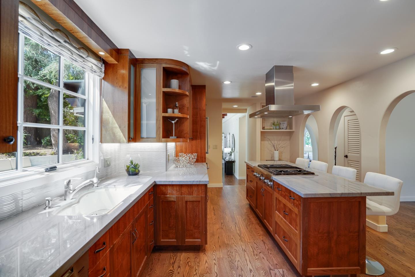 472 Edgewood Road San Mateo, CA 94402 - Photo 25 of 77 a kitchen with stainless steel appliances granite countertop a sink stove and cabinets