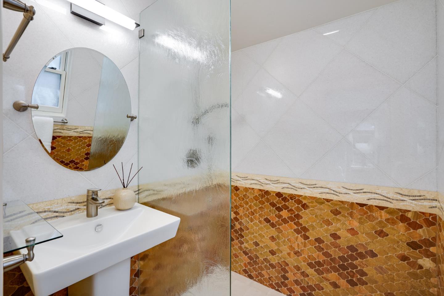 472 Edgewood Road San Mateo, CA 94402 - Photo 34 of 77 a bathroom with a sink mirror and vanity