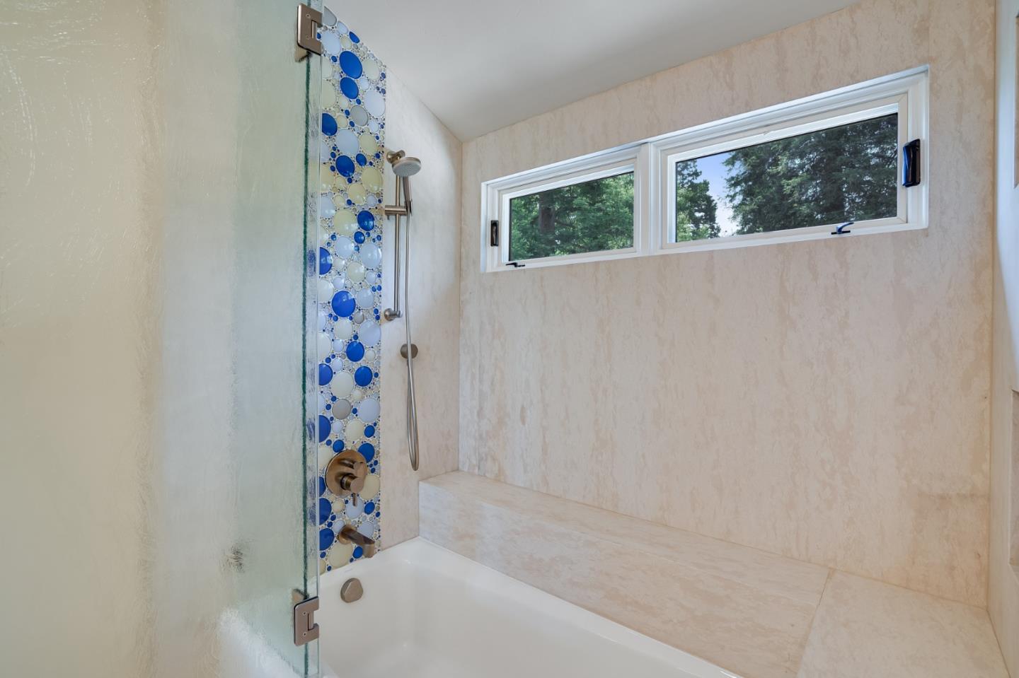 472 Edgewood Road San Mateo, CA 94402 - Photo 42 of 77 a bathroom with a bathtub and shower