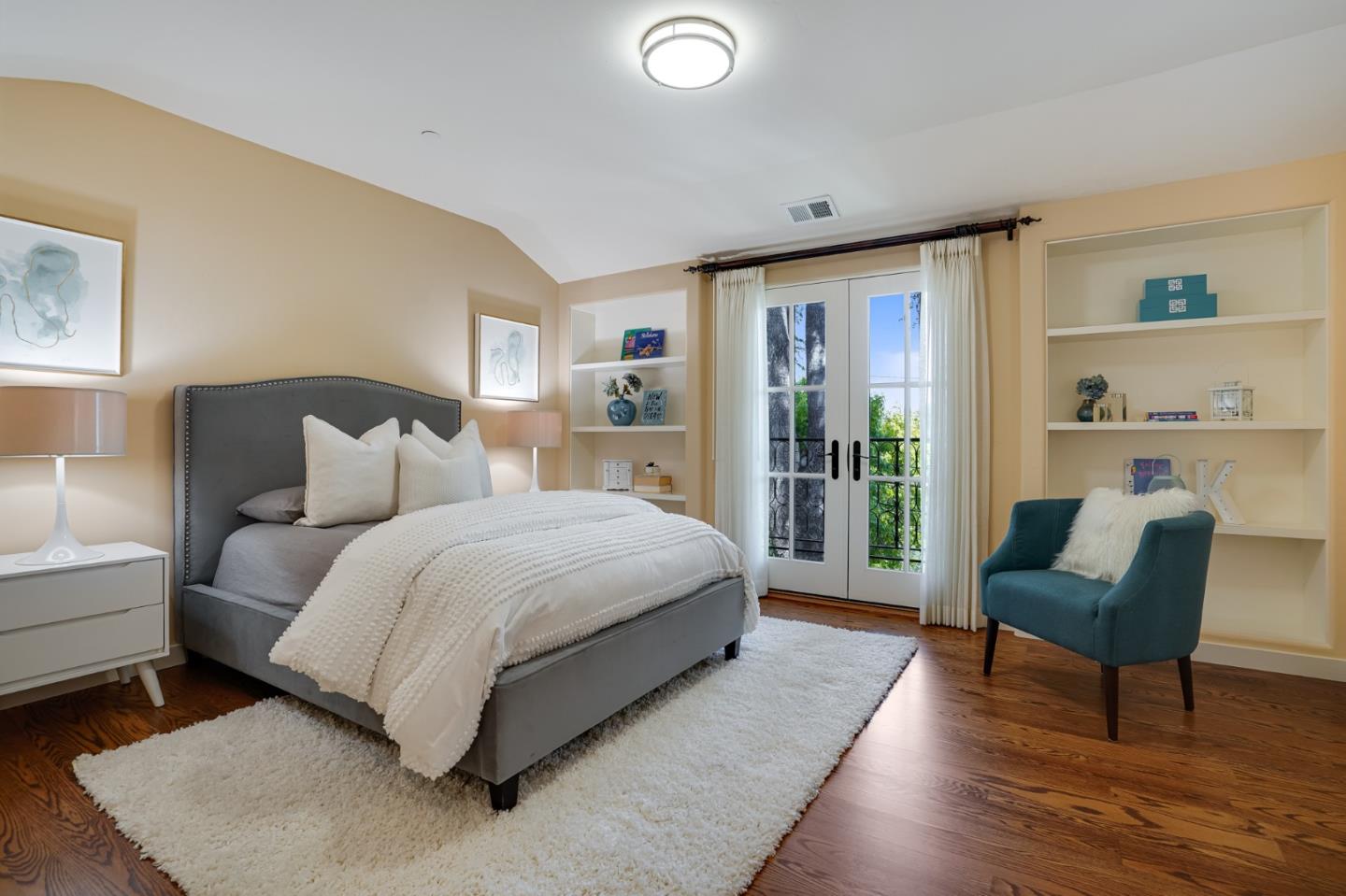 472 Edgewood Road San Mateo, CA 94402 - Photo 43 of 77 a spacious bedroom with a bed and a couch