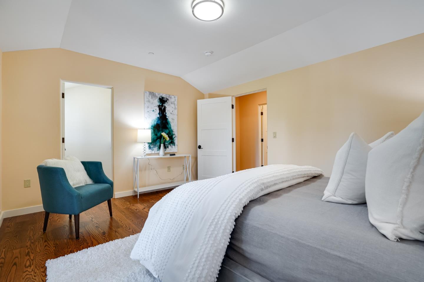472 Edgewood Road San Mateo, CA 94402 - Photo 44 of 77 a bedroom with a bed and chair