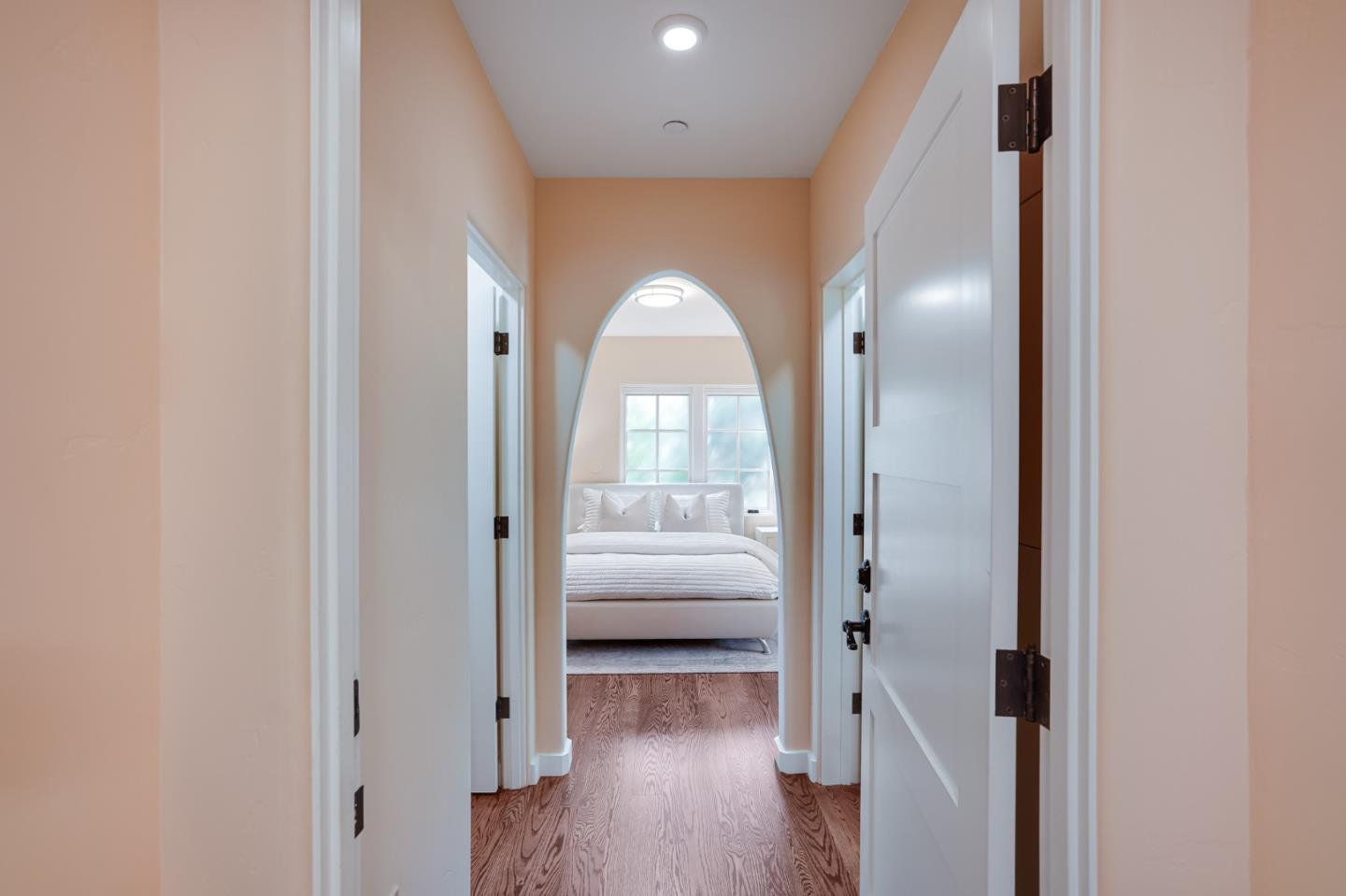472 Edgewood Road San Mateo, CA 94402 - Photo 46 of 77 a view of a hallway with wooden floor and stairs