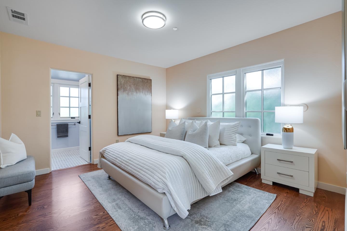472 Edgewood Road San Mateo, CA 94402 - Photo 47 of 77 a bedroom with a bed and wooden floor